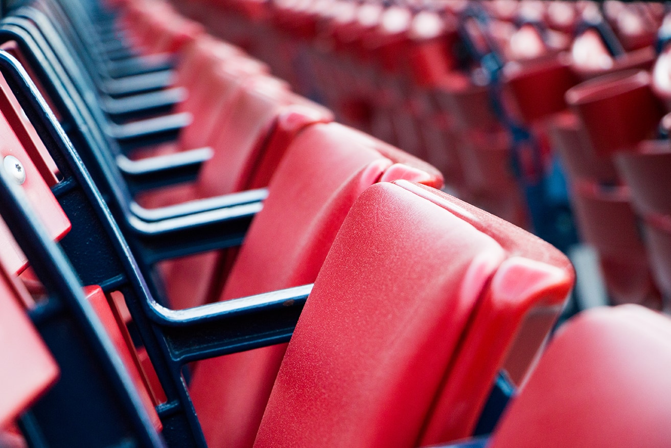 red seats in a minor league baseball stadium